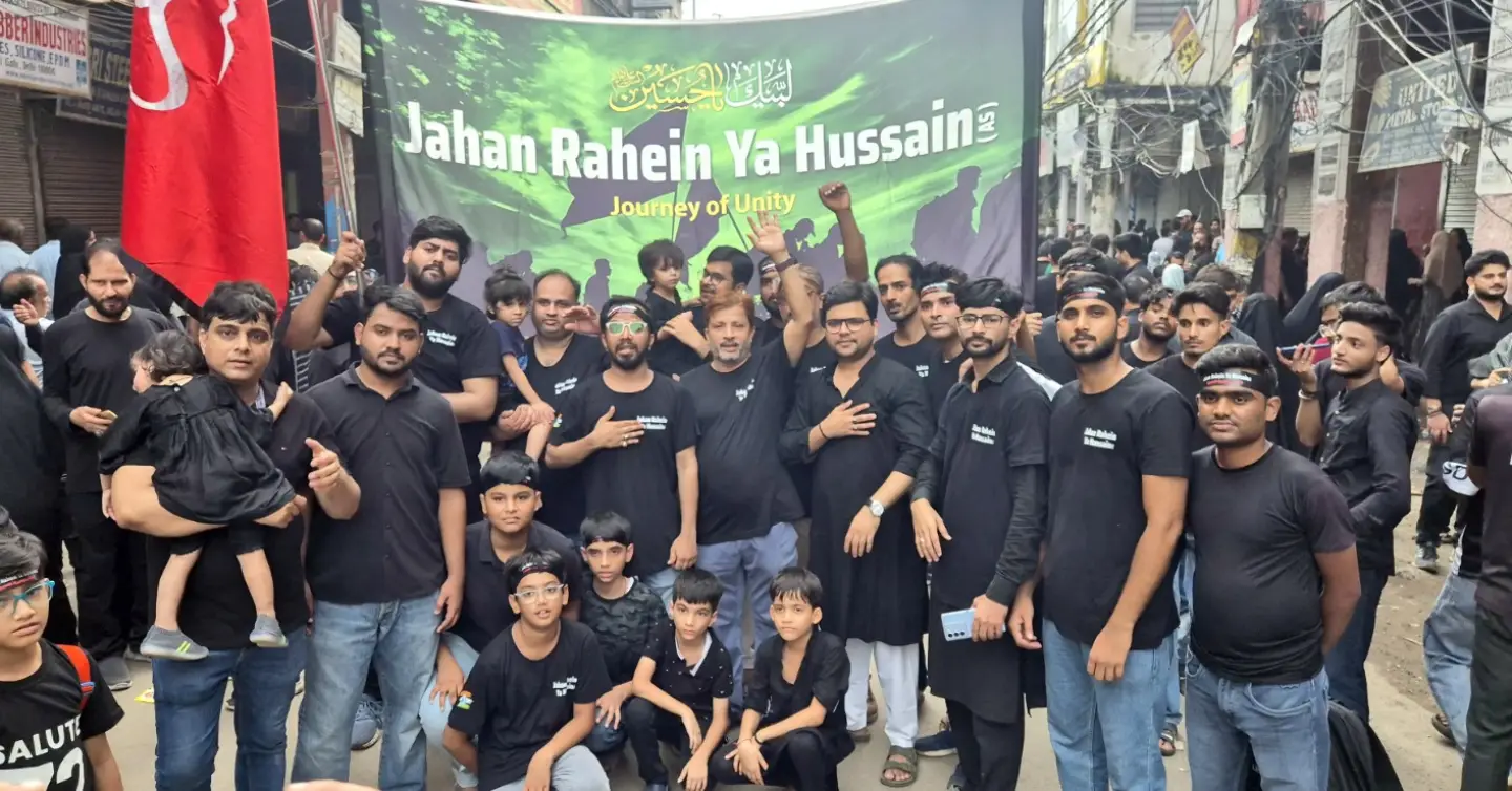 Jahan Rahein Ya Hussain azadars walking together under the Arbaeen banner in Delhi